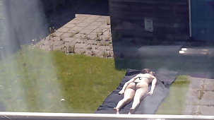 Sunbathing (Partly Topless)